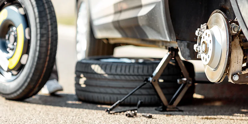 Tips for Handling a Flat Tire Replacement While on the Road