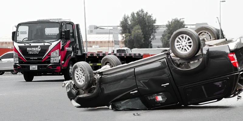 Why Is Contacting a Towing Company Essential When Dealing with an Overturned Vehicle?